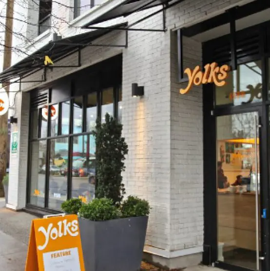 Yolks storefront with signage