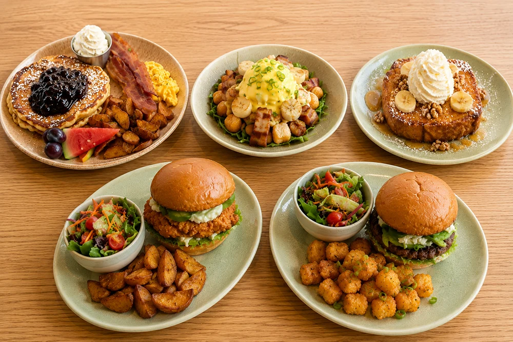 New menu items at Yolks including breakfast favourites, smash burgers, fried chicken sandwiches, and brunch dishes.